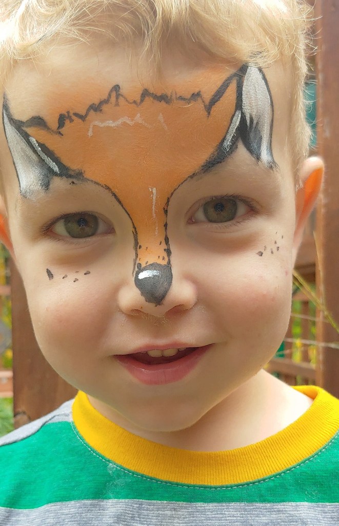 Boy with fox face paint